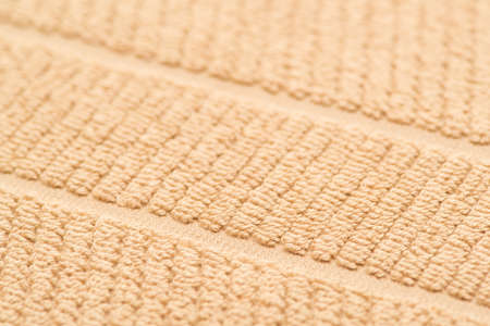 bath towel brown, close-up. textured fabric background