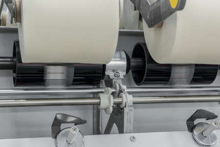 Machinery and equipment in the workshop for the production of thread, close-up. interior of industrial textile factoryの写真素材