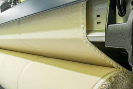 weaving loom at a textile factory, closeup. industrial fabric production lineの写真素材