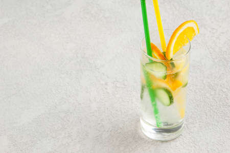 summer cooling drink with lemon and cucumber in a glass