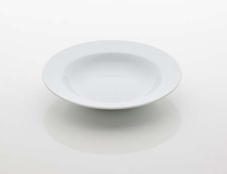 ceramic kitchen plate on white backgroundの写真素材