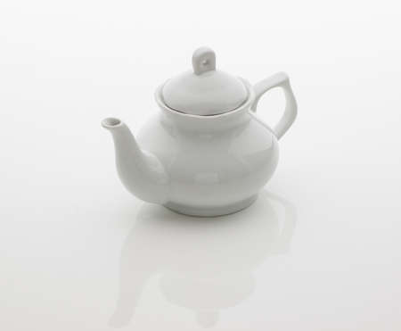 ceramic kitchen teapot on white backgroundの写真素材