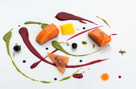 Beautifully decorated pieces of fish on white background