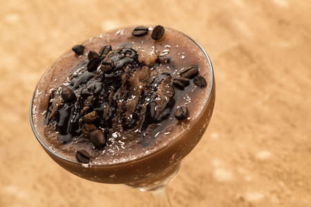 Chocolate smoothie on a light brown background
