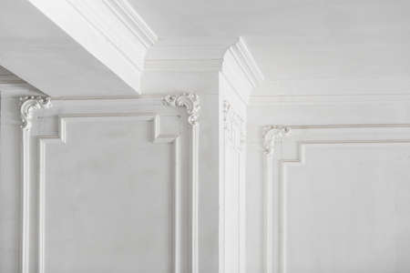 unfinished plaster molding on the ceiling and columns. decorative gypsum finish. plasterboard and...