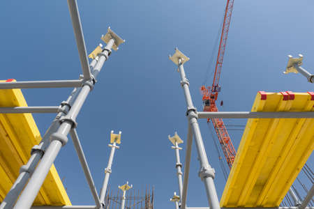 metal concrete structures of the building under construction. scaffolding and supports on a crane...