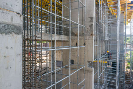 the builder performs work standing on high scaffolding