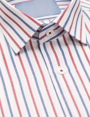 striped shirt with a focus on the collar and button, close-upの写真素材