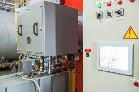 modern industrial boiler room with compressor equipment. control panel