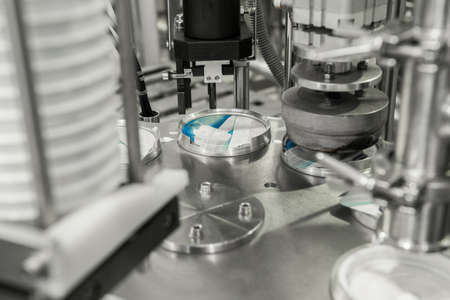 production and bottling of yogurt in plastic cups. equipment at the dairy plant