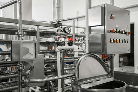 electronic control panel and tank at a milk factory. equipment at the dairy plantの写真素材