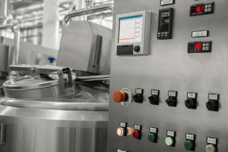 electronic control panel and tank at a milk factory. equipment at the dairy plantの写真素材
