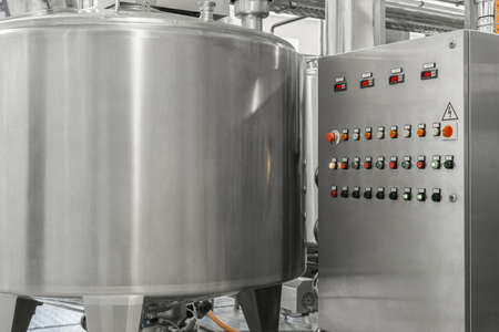 electronic control panel and tank at a milk factory. equipment at the dairy plantの写真素材