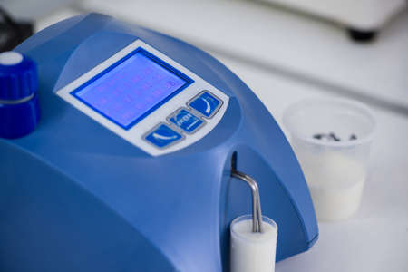 analysis and testing of dairy products on a modern device. test laboratory of a milk factoryの写真素材