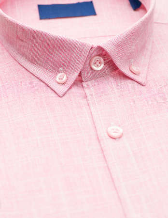 red shirt with a focus on the collar and button, close-upの写真素材