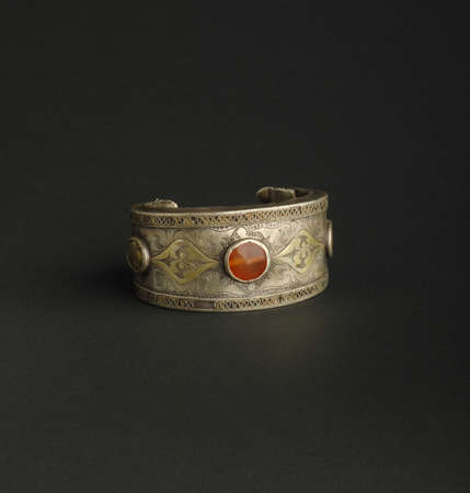 ancient antique bracelet with stones on black background. Middle-Asian vintage jewelryの写真素材