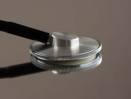medical stethoscope on mirror background with reflection. isolated, close-up