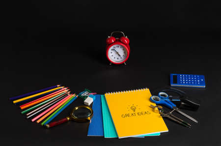 colorful collection of school supplies set on black background. back to school. great ideas