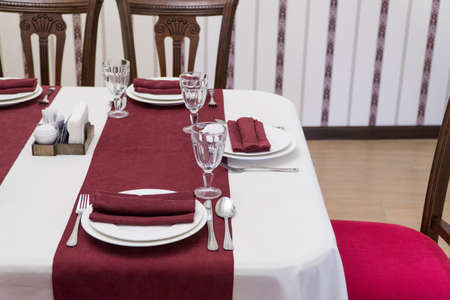 serving banquet table in a luxurious restaurant in red and white style