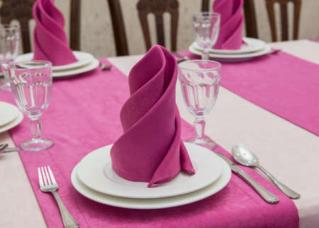 serving banquet table in a luxurious restaurant in pink and white styleの写真素材