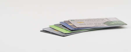 Stack of multi-colored credit cards on a white background. Isolatedの写真素材
