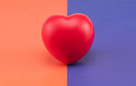 Toy heart on a colored background. Concept healthcare. Cardiology - care of the heartの写真素材