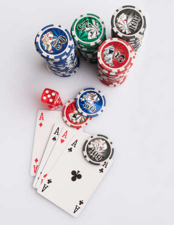 Poker chips, cards and dice on a white background. The concept of gambling and entertainment. Casino...