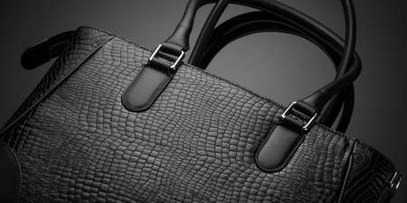 Black fashionable designer women's bag on a dark backgroundの写真素材