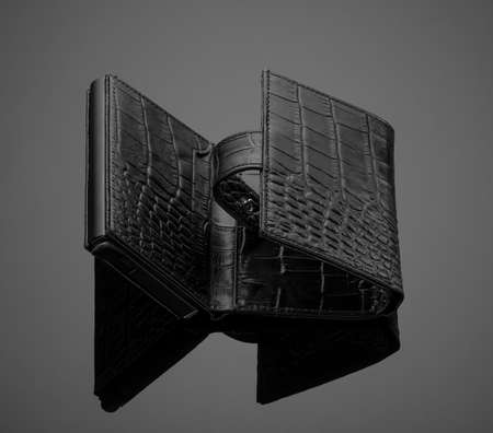 Fashionable leather men's wallet on a dark backgroundの写真素材