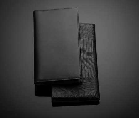 Fashionable leather men's wallet on a dark backgroundの写真素材