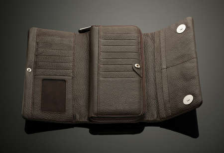 Fashionable leather men's wallet on a dark background