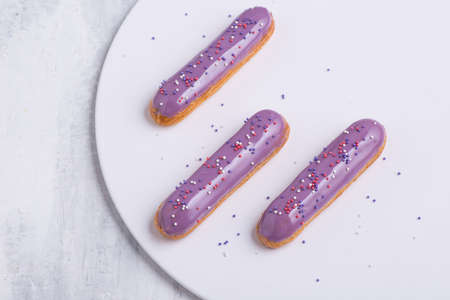 delicious cake with icing on a white plateの写真素材