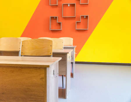 Empty school classroom with chairs, desks. Interior of a school classroomの写真素材