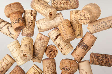 Tashkent, Uzbekistan - March 19, 2008: Heap of old wine corks on white background. Studio...