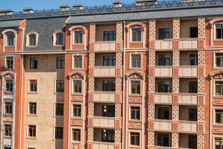 Finishing works on the facade of a new residential buildings