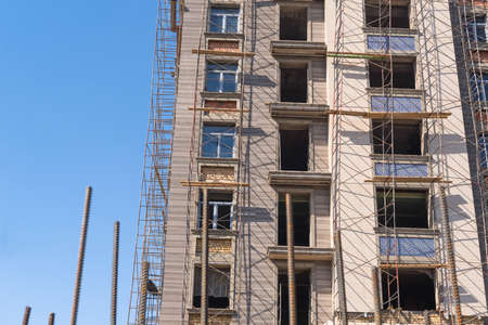 Finishing works on the facade of a new residential buildings