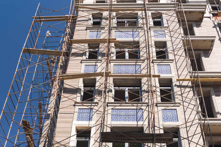 Finishing works on the facade of a new residential buildingsの写真素材