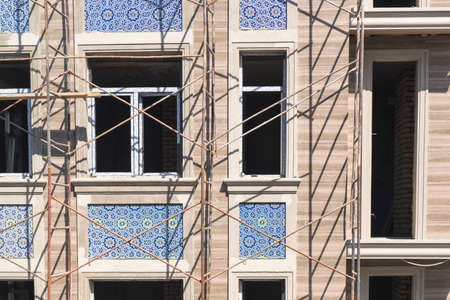 Finishing works on the facade of a new residential buildingsの写真素材