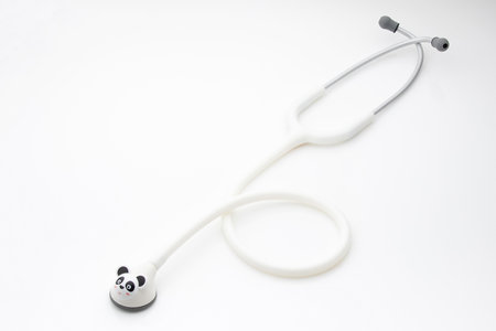 Pediatric stethoscope with panda head on a white backgroundの写真素材