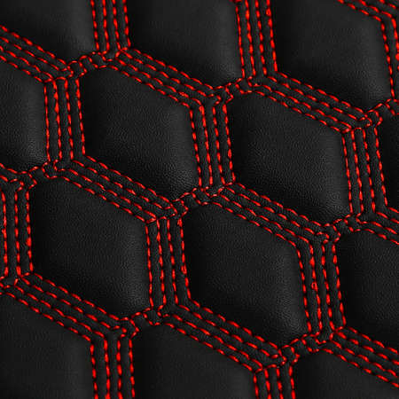 Texture of black leather background with square pattern and red stitch, macroの写真素材