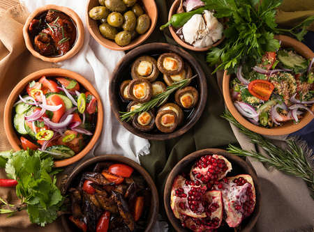 A top view of a restaurant table with gourmet Georgian dishes