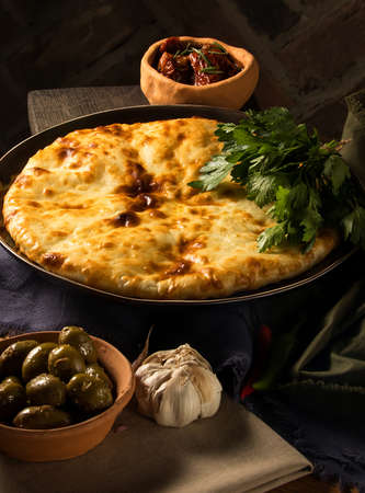 A vertical shot of a luxurious restaurant table with gourmet Georgian dishesの写真素材