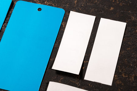 A closeup shot of blank blue and white paper tags for clothing sales