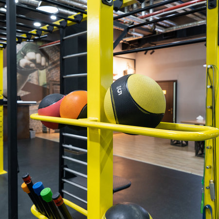 A vertical closeup of balls in the sports hall
