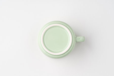 A shot of the underside of a pastel green tea cup. top viewの写真素材