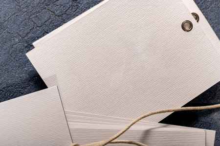 A closeup shot of blank white paper clothing tags for fashion designの写真素材