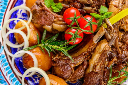 A top view of a national Uzbek dish with meat and potatoesの写真素材