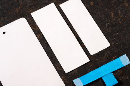A closeup shot of blank blue and white paper tags for clothing sales