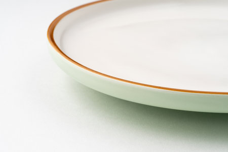 A ceramic green plate isolated on white background
