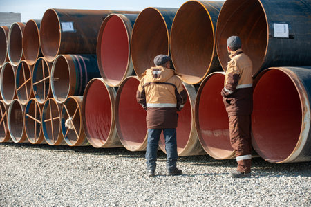 A line of oilfield large streel pipes in industrial construction area